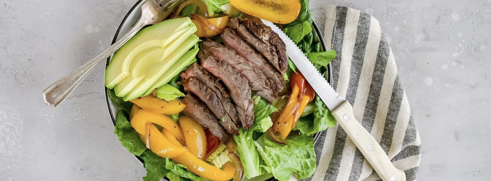 fajita steak salad with avocado and yellow bell peppers